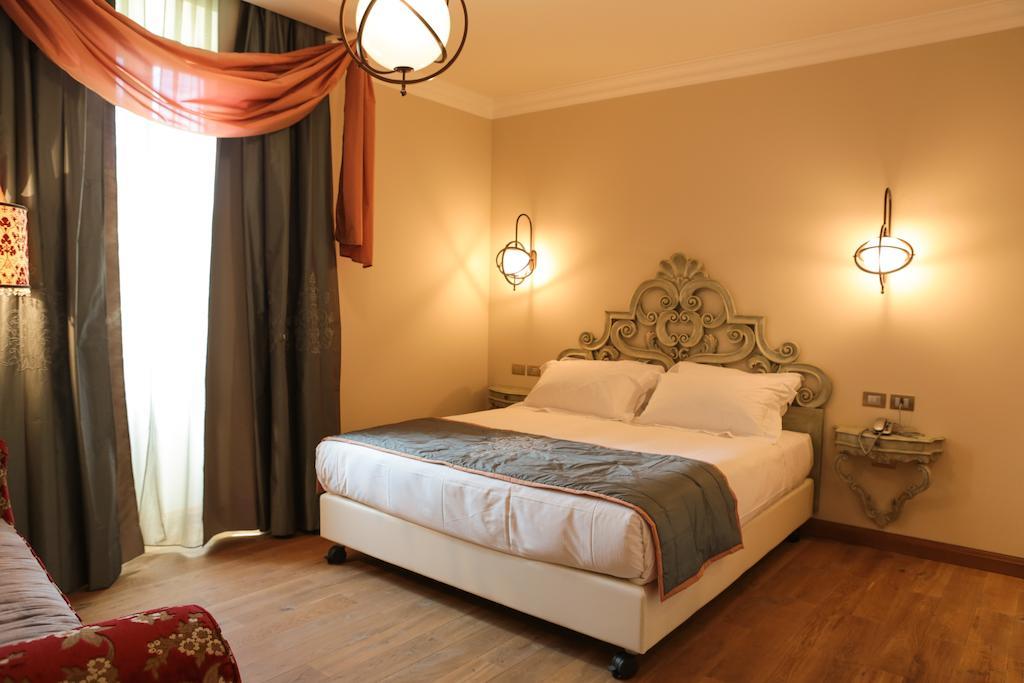 Ville Sull'Arno Флоренция Экстерьер фото A bedroom at the hotel